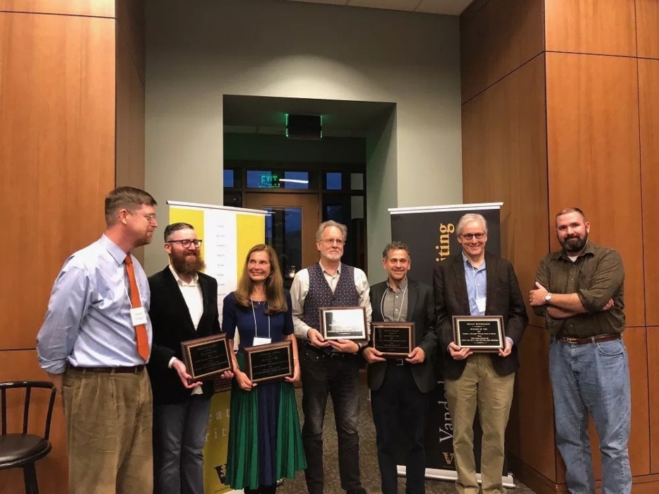 Ryan Wilson (far right) presents the Meringoff Writing Awards