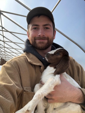 Jeff with a goat kid