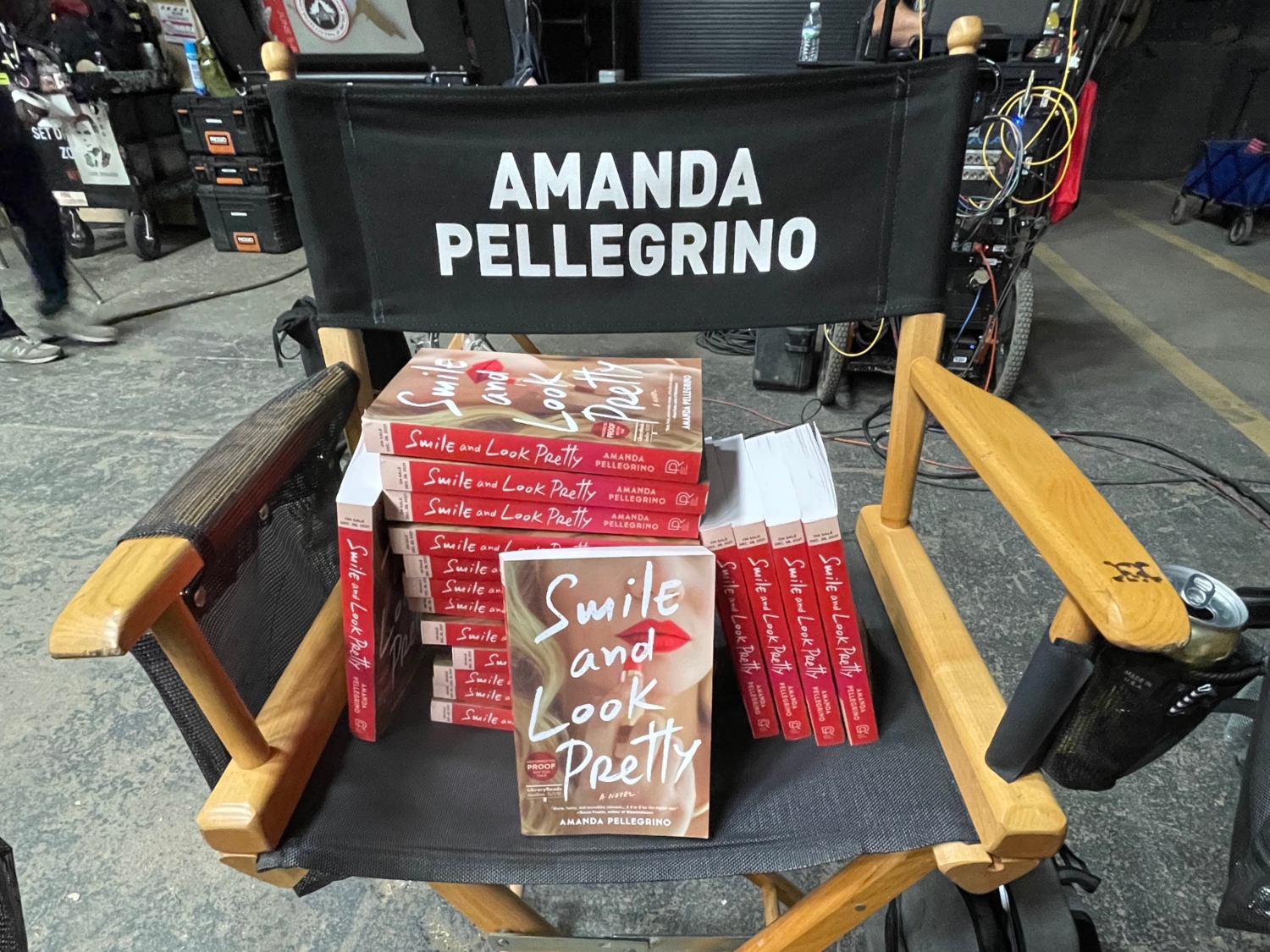 A stack of Amanda's books on her chair on set